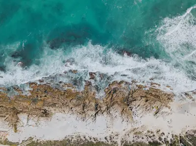 an aerial view of the ocean and a beach at Lloyd's Inn Bali in Seminyak