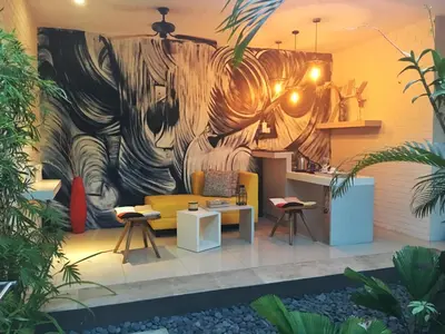 a room with a large painting on the wall at La Belle Villa in Seminyak
