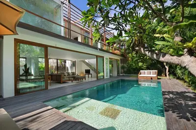 a swimming pool in the backyard of a house at Beach Axis Villa, Seminyak in Seminyak