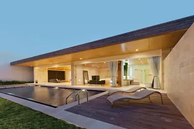 an exterior view of a house with a swimming pool at One Eleven in Seminyak