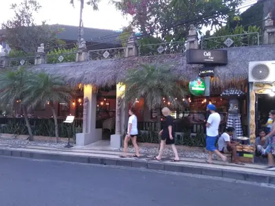 a group of people walking in front of a store at Villa Made West in Seminyak