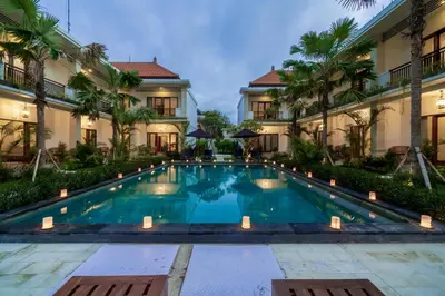 an image of a swimming pool in front of a building at Puri Uma Ratu by RPM in Seminyak