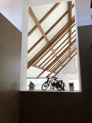 a bike sitting on a window sill in a room at Villa Dea in Nusa Dua