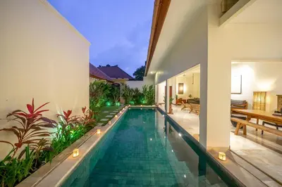 a swimming pool in the middle of a villa at Amandaru Villa by RPM in Legian