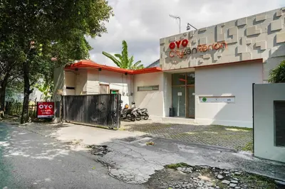 a building with a gate in front of it at Cityzen Renon Hotel in Denpasar