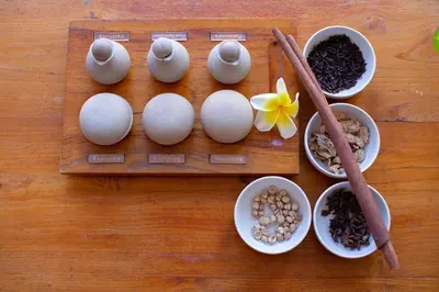 a wooden table with eggs and bowls of ingredients at THE 1O1 Bali Fontana Seminyak in Legian