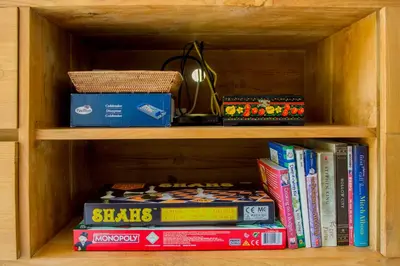 a book shelf filled with lots of books at Villa Orked 2 in Seminyak