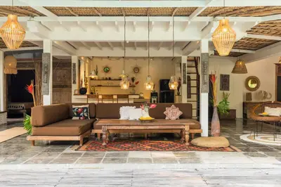 a living room with a couch and a table at Oma Villa - A tropical sanctuary of Seminyak in Seminyak