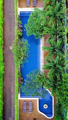 an overhead view of a swimming pool with trees at Rhadana Hotel in Kuta