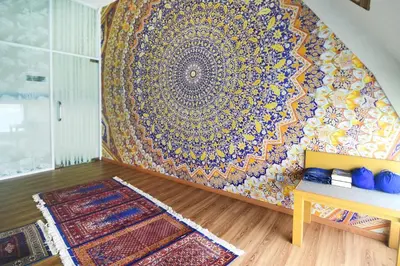 a room with a large tapestry on the wall at Rhadana Hotel in Kuta