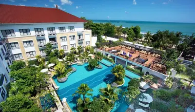 an aerial view of a resort with a swimming pool at Truntum Kuta Bali in Kuta