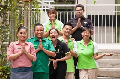 a group of people posing for a picture at Grandmas Plus Hotel Legian in Legian