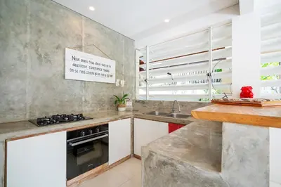 a kitchen with a sink and a stove at Villa Love Umalas in Kerobokan