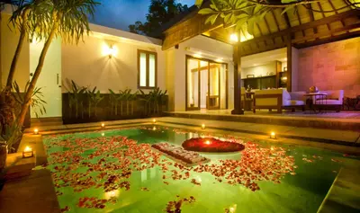 a swimming pool with lights in a house at The Astari Villa and Residence in Jimbaran