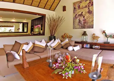 a living room with a couch and a table at Villa Bali Asri in Seminyak