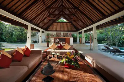 a living room with couches and a table at Villa Bali Asri in Seminyak