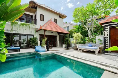 a villa with a swimming pool and a house at 3BR Villa Carissa Seminyak Centre, Bali by Le Ciel Hospitality in Seminyak