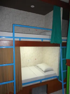 a bedroom with two bunk beds in a room at Meriki Apartment in Seminyak