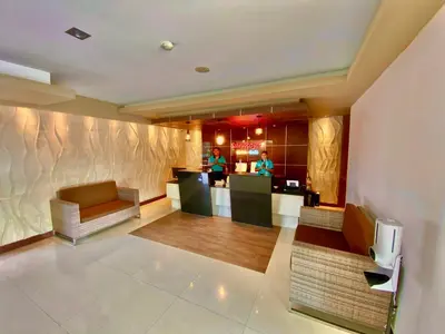 a lobby of a hotel with two people in the background at Sun Royal Hotel in Kuta