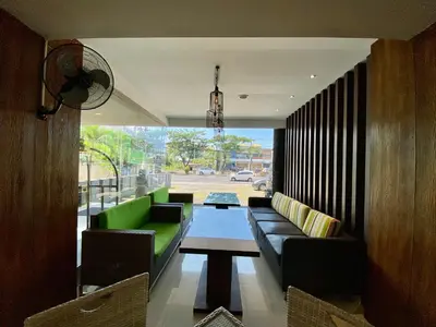 a living room with a couch and a table at Sun Royal Hotel in Kuta