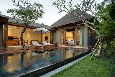 a swimming pool in the backyard of a villa at KoenoKoeni Villa in Seminyak