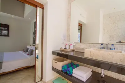 a bathroom with a sink and a mirror at Vishuddha Ajna Villa - Outstanding 2 bdr villa - GREAT LOCATION! in Seminyak