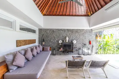 a living room with a couch and a table at Vishuddha Ajna Villa - Outstanding 2 bdr villa - GREAT LOCATION! in Seminyak