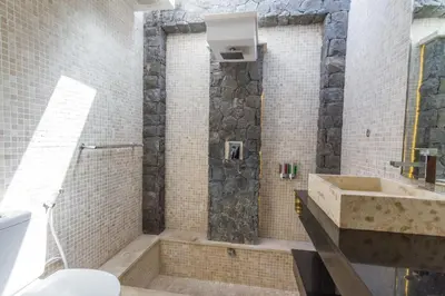 a bathroom with a shower and a sink at Vishuddha Ajna Villa - Outstanding 2 bdr villa - GREAT LOCATION! in Seminyak