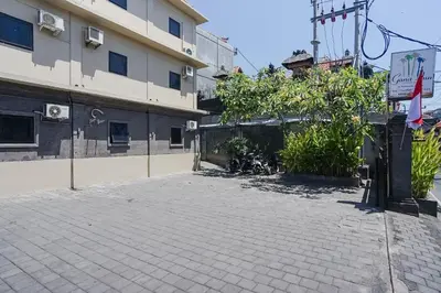 an empty parking lot in front of a building at Gana Inn Legian in Legian