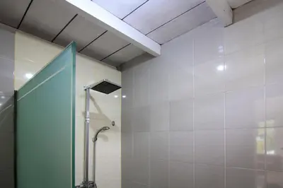 a shower with a glass door in a bathroom at Villa Seminyak Estate & Spa - By Astadala in Seminyak