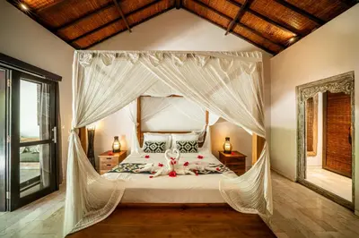 a bedroom with a bed with a canopy at Villa Koala, 2Br Close to W, Potato Head and Shi Shi in Seminyak