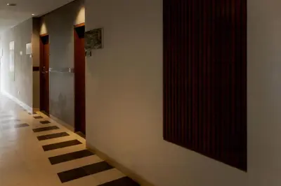 a hallway with a large mirror on the wall at Fourteen Roses Boutique Hotel, Kuta in Legian