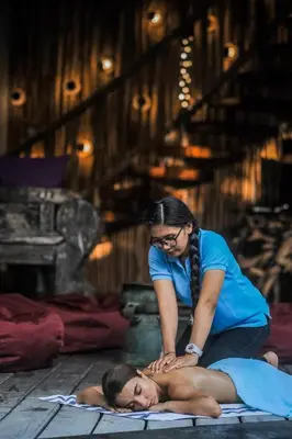 a woman laying on the floor with a woman laying on the ground at Luxury Villas Merci Resort 3BR Seminyak #1 in Seminyak
