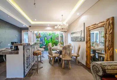 a dining room with a table and chairs at Luxury Villas Merci Resort 3BR Seminyak #1 in Seminyak