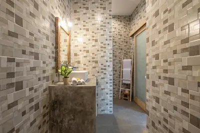 a bathroom with a sink and a mirror at Villa Arif in Seminyak