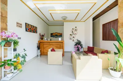 a living room with boxes and plants on the floor at Wayan House Seminyak in Seminyak
