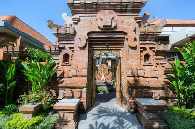 an entrance to a building with an ornate doorway at Wayan House Seminyak in Seminyak