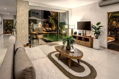 a living room with a couch and a coffee table at Villa Verde in Seminyak