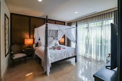 a bedroom with a bed with a canopy at Villa Deh Simba at Ayana With Private Pool in Jimbaran