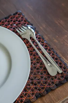 a fork and knife sitting on a mat next to a plate at Villa Deh Simba at Ayana With Private Pool in Jimbaran