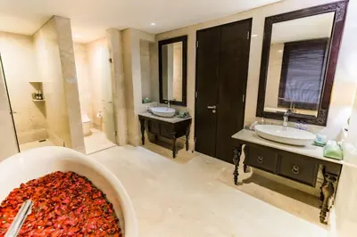 a bathroom with a sink and a tub of cherries at Villa Deh Simba at Ayana With Private Pool in Jimbaran