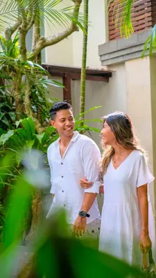 a man and a woman standing next to a building at tanadewa Villas Nusa Dua Bali by Cross Collection in Nusa Dua