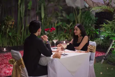 a man and a woman sitting at a table at Sandi Agung Villa in Seminyak
