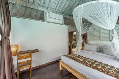 a bedroom with a bed and a window at Villa Laksmana Hideaway 2 - Surrounded by water- 2bd villa with fantastic pool! in Seminyak