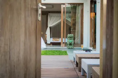 a door leading to a room with a bedroom at VILLA DUNA Seminyak Bali in Seminyak