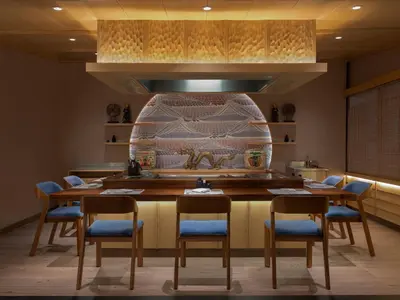 a dining room with a table and chairs at Hotel Nikko Bali Benoa Beach in Nusa Dua