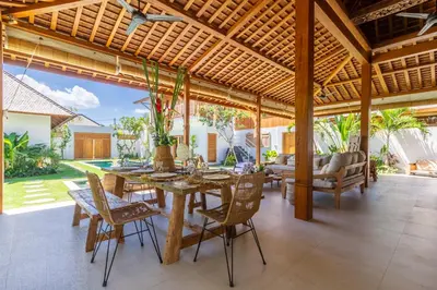 an outdoor dining room with a table and chairs at Villa Namu by Alfred in Bali in Seminyak