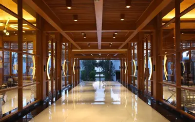 a hallway of a building with wooden floors and windows at The Samaya Seminyak Bali in Seminyak