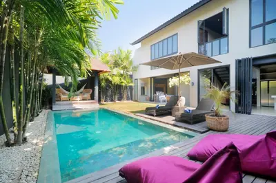 a swimming pool in the backyard of a house at Villa Suku Berawa in Canggu