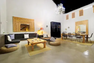 a living room with a couch and a table at Villa Suku Berawa in Canggu